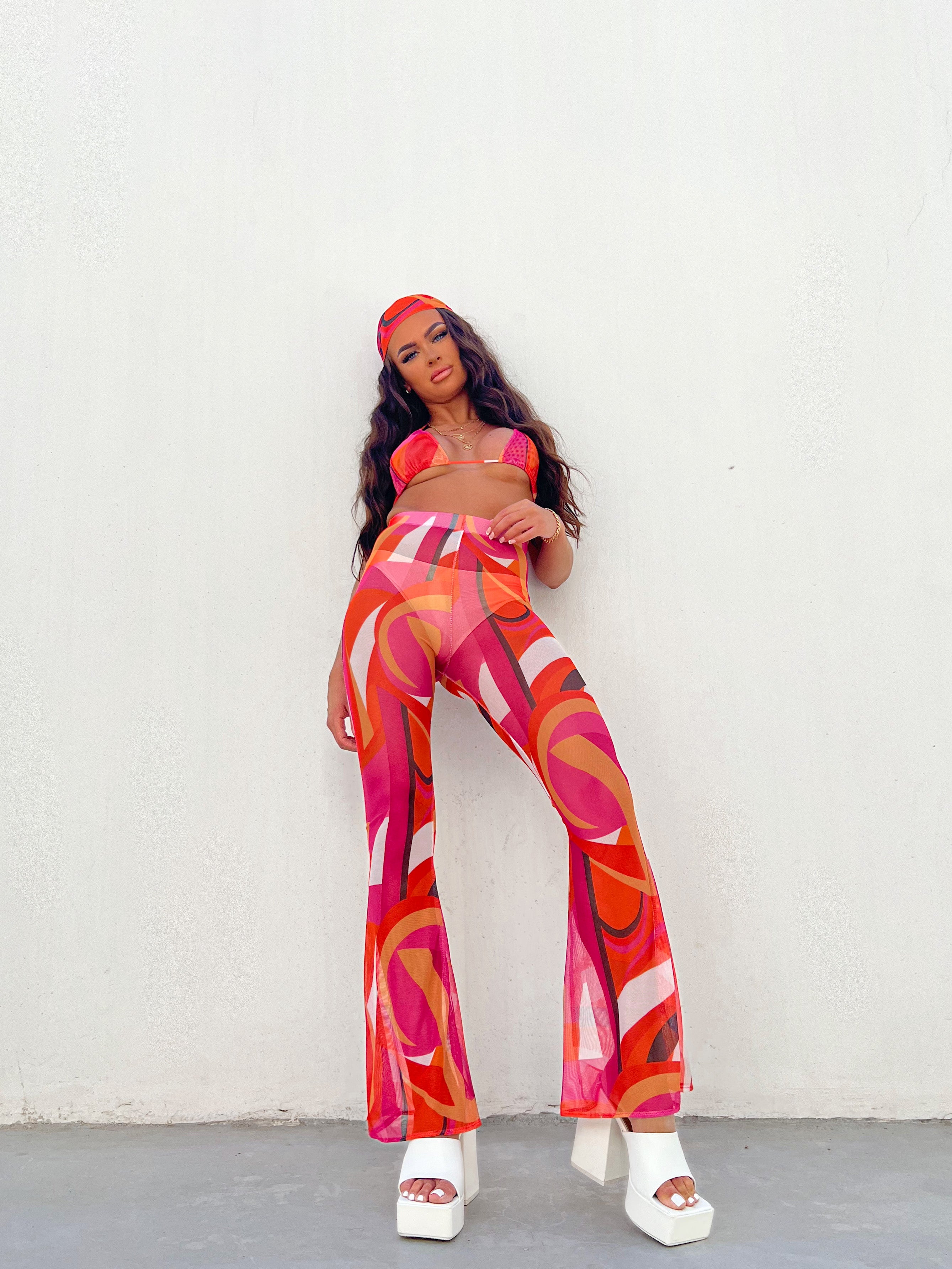 Flared trousers in pink and orange mesh